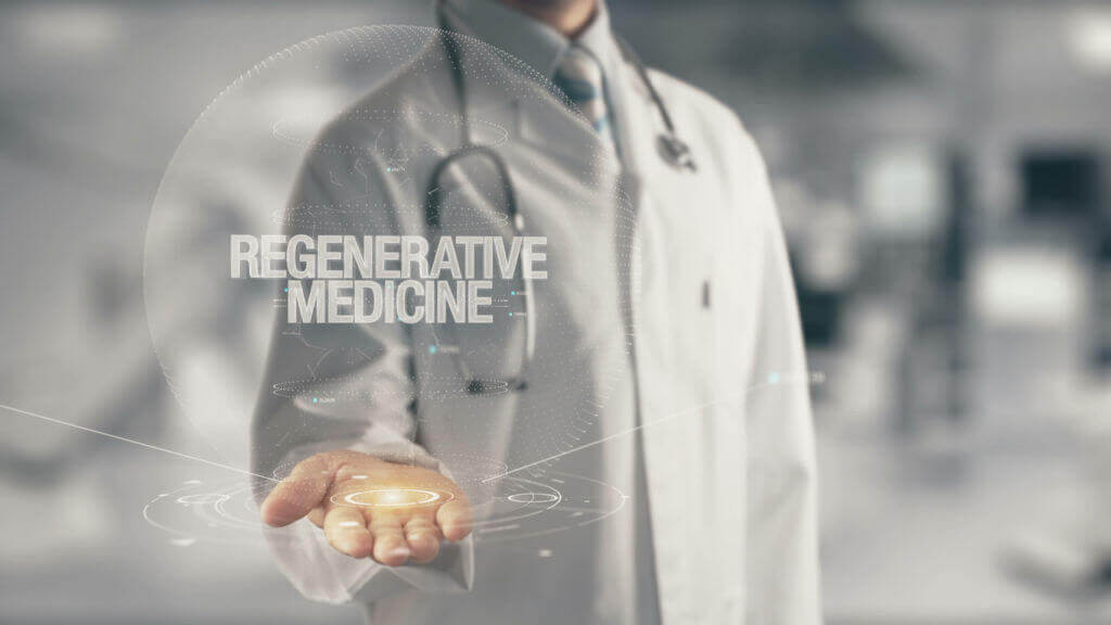 Doctor holding in hand the phrase Regenerative Medicine